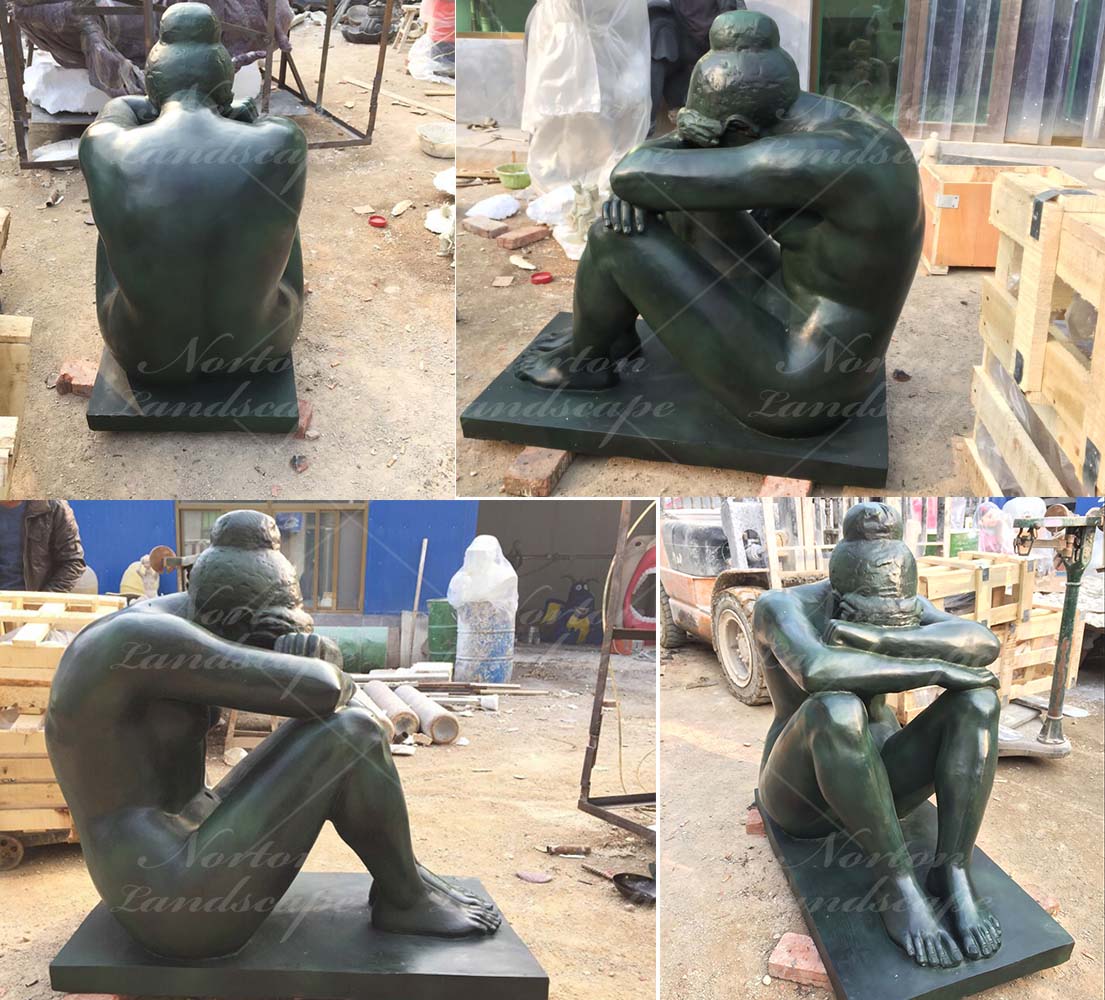 Bronze sitting nude woman statue