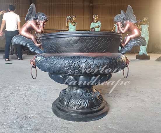 bronze flowerpot with angel statues