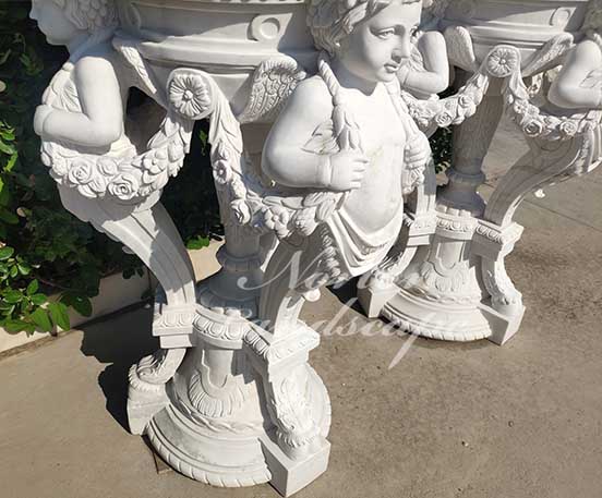 marble flowerpot with children statues