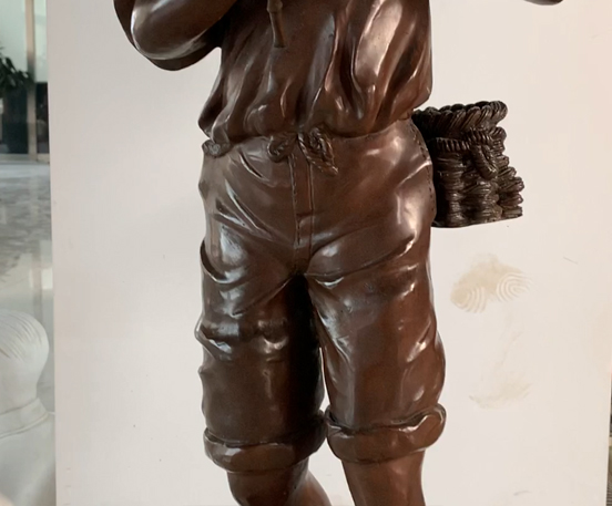 Bronze boy sculpture