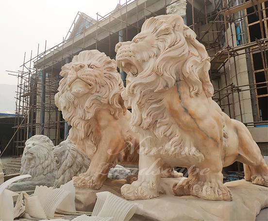 Sunset red marble lion statues