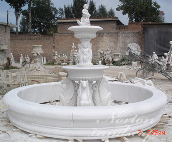 Marble fountain with swan statues