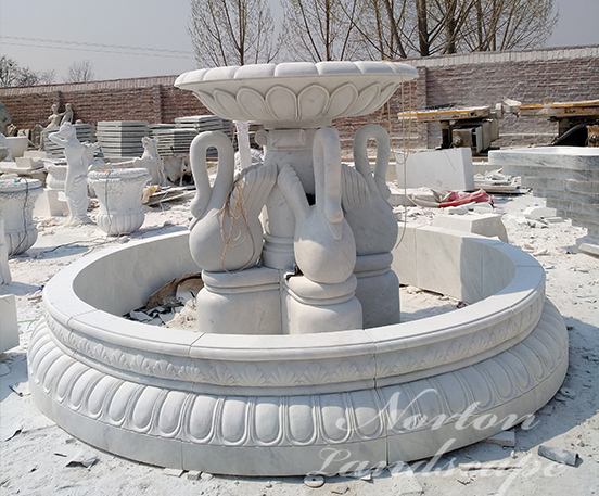 Marble fountain with swan statues