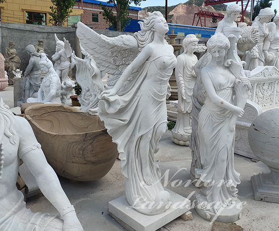 White marble angel statues with wings