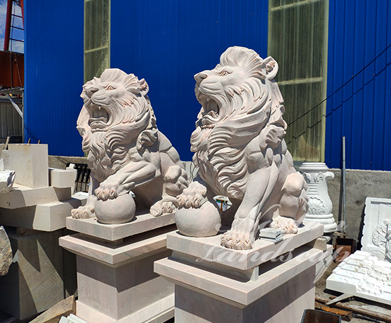 Sitting marble lion statues