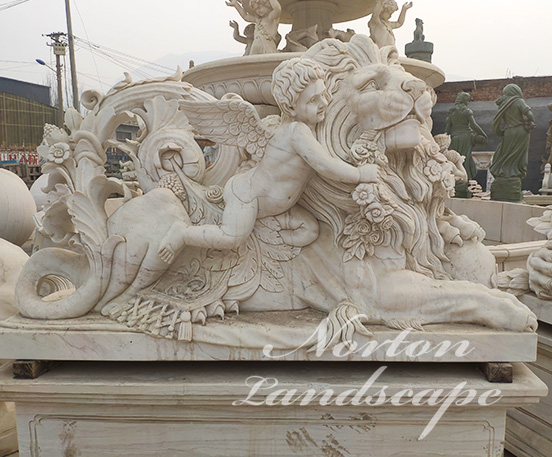 Marble cherub and lion statues
