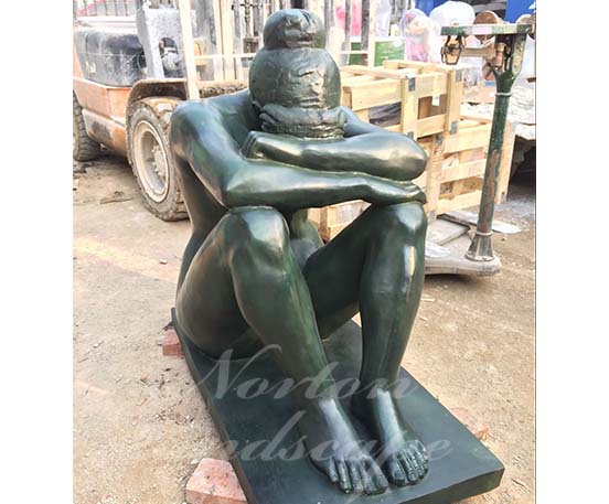 Bronze sitting nude woman statue