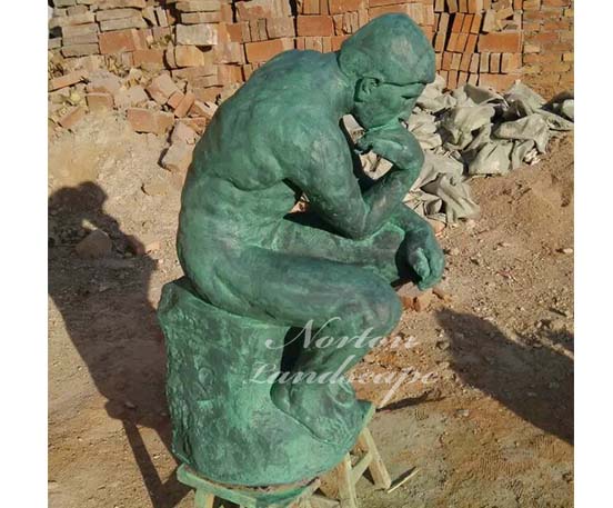 Bronze thinking man statue