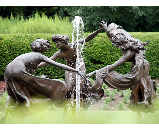 Bronze women playing statue fountain