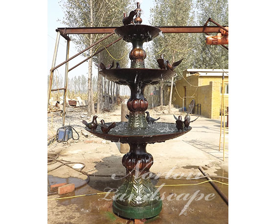 Bronze bird statue fountain