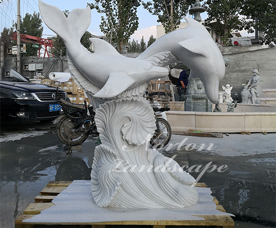 White marble dolphin statue