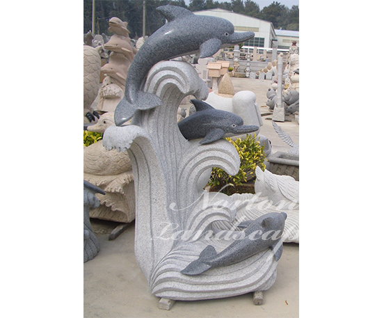 White marble dolphin statue