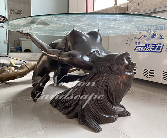 Bronze woman coffee table sculpture
