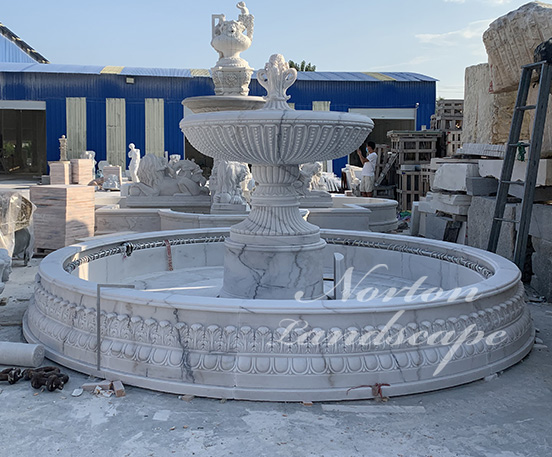 Large white stone marble water fountain