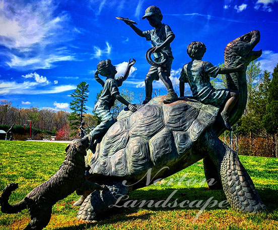 Bronze tortoise and child statue
