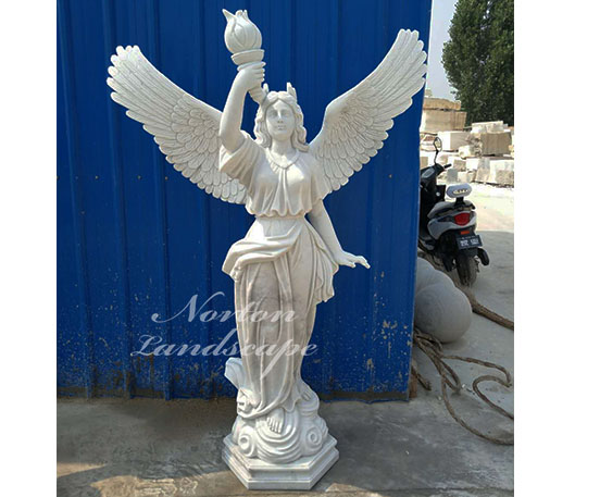 Marble statue of an angel holding a torch