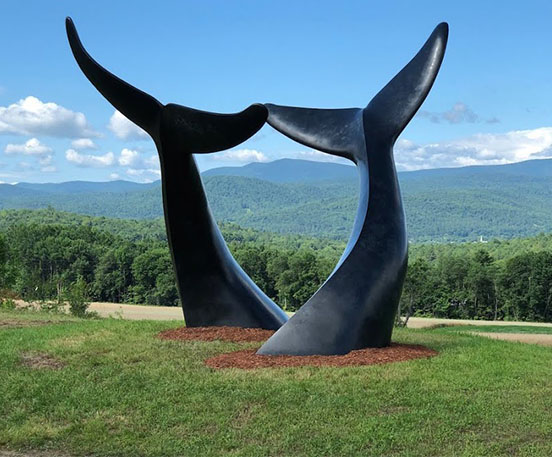 Bronze whale tail sculpture