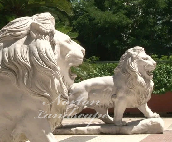 A pair of front door lion statues