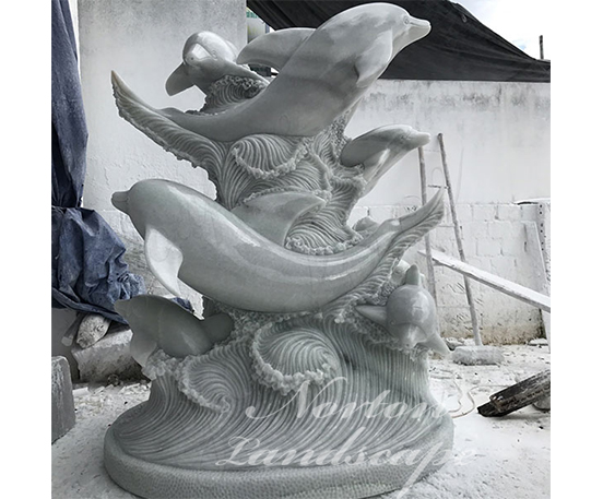 Stone marble dolphin statues