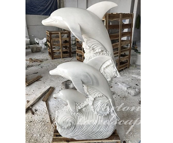 Stone marble dolphin statues
