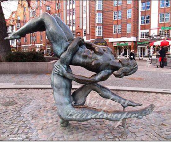 bronze acrobatics nude man statue